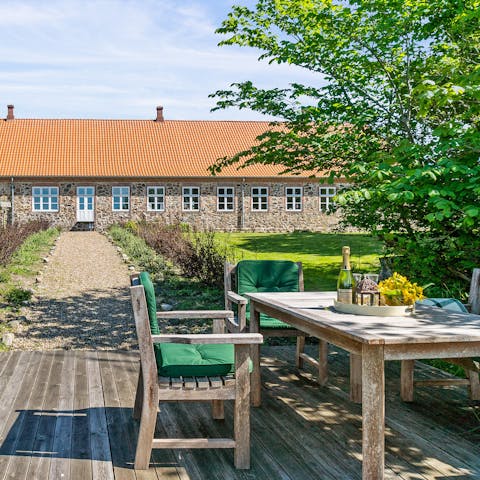 Dine alfresco on the deck overlooking the sea and heath