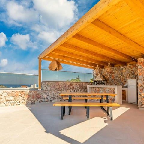 Enjoy the sea view while using the outdoor kitchen