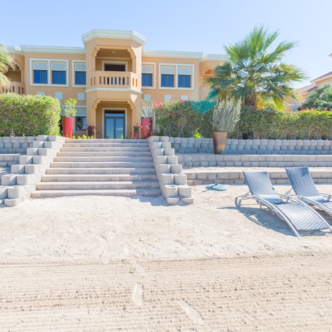 Pad barefoot straight from the lawn to the soft-sanded beach