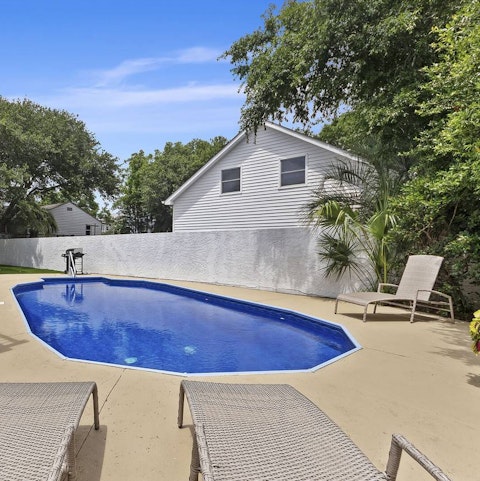 Lounge beside the private salt-water pool