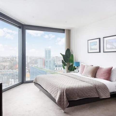 Wake up to skyscraper views over the city from your bedroom