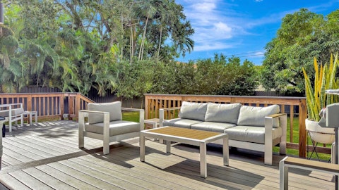 Stretch out on the deck surrounded by tropical greenery