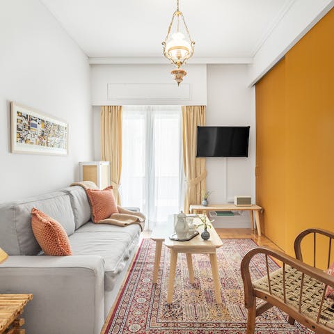 Kick back in the bright living room with a glass of wine after a day of exploring the city on foot