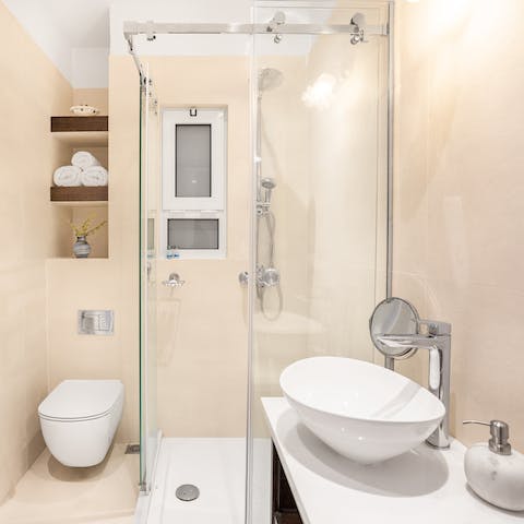 Start mornings with a relaxing soak under the bathroom's rainfall shower