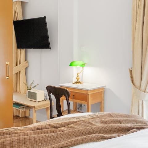 Catch up on work at the bedroom's desk space