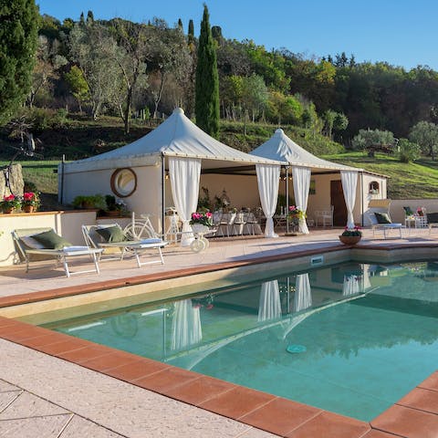 Lounge by the south-facing pool with its panoramic views