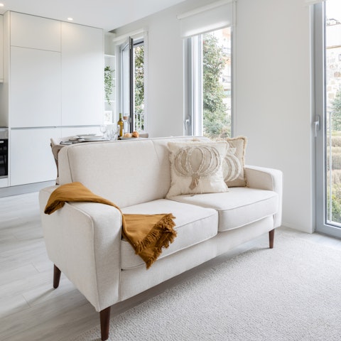 Kick-off your shoes and sprawl out on the soft cream couch after a long day