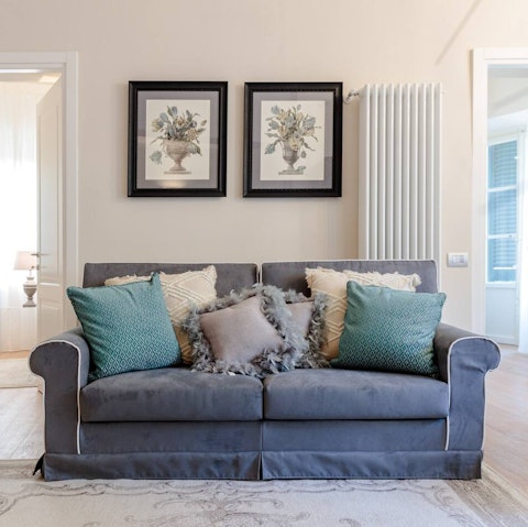 Relax in the stylish living space at the end of a busy day exploring the Walled City