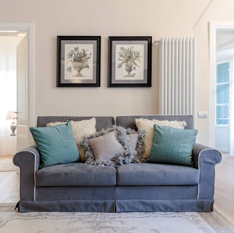 Relax in the stylish living space at the end of a busy day exploring the Walled City