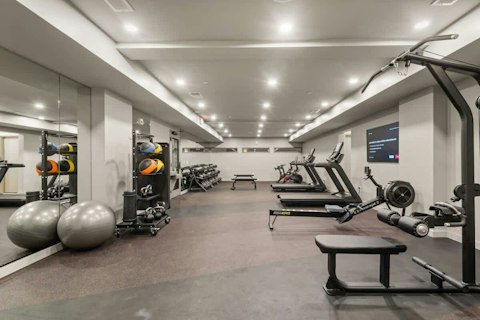 Train in the well-equipped building gym without leaving home