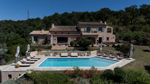Enjoy sunny afternoons by the pool overlooking the wooded countryside