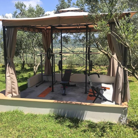 Start your day with a workout in the shady outdoor gym area so you can relax all day guilt-free