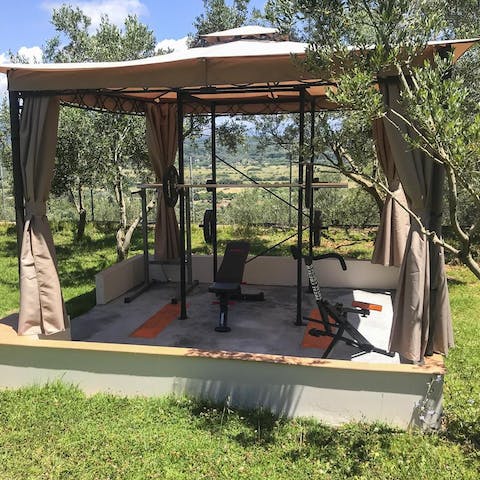 Start your day with a workout in the shady outdoor gym area so you can relax all day guilt-free