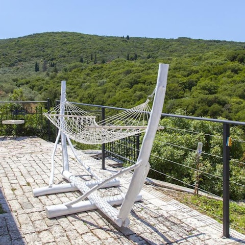 Get lost in a good book while swinging gently in the hammock, overlooking the luscious hillscape