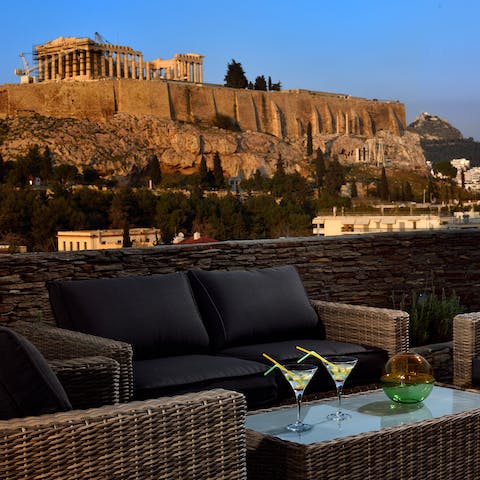 Sip a cocktail under the watchful eye of the ancient Parthenon