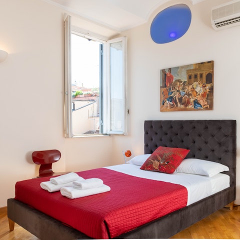 Wake up to sunshine streaming into the art-filled apartment