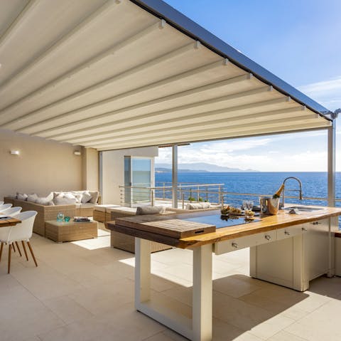Enjoy a family feast on the terrace with views overlooking the Alghero Gulf