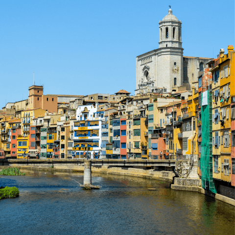 Explore Girona and its medieval architecture, just under forty minutes away by car