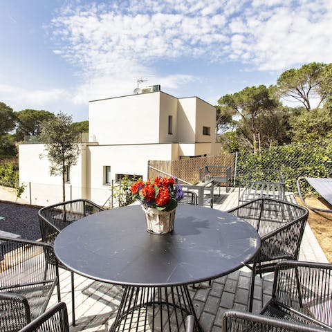 Sip celebratory sundowners on the raised patio