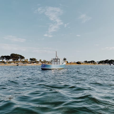 Hire a boat from Sandbanks beach – a twenty-one-minute walk away