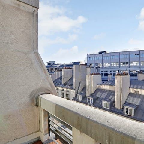 Enjoy a glass of French wine on the balcony at sunset