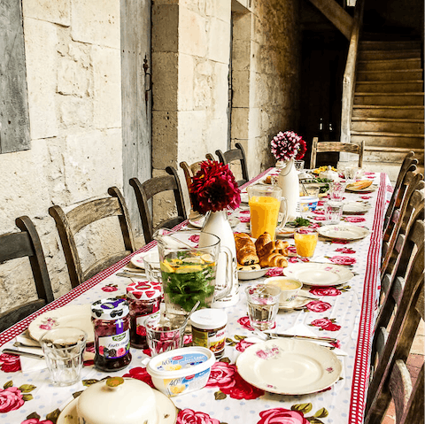 Enjoy a delicious breakfast of French pastries in the outdoor dining area