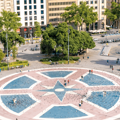 Stroll around bustling Plaça de Catalunya, fifteen minutes on foot from your door