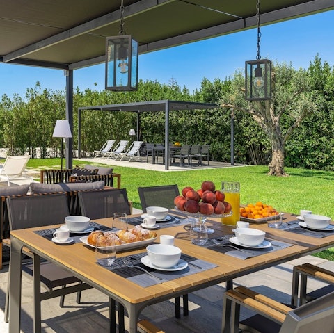 Enjoy a leisurely breakfast at the alfresco dining table