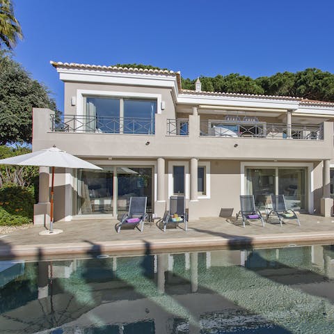 Laze on a sun lounger by the pool