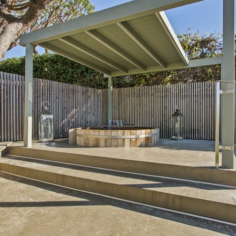 Enjoy a candlelit soak in the outdoor hot tub