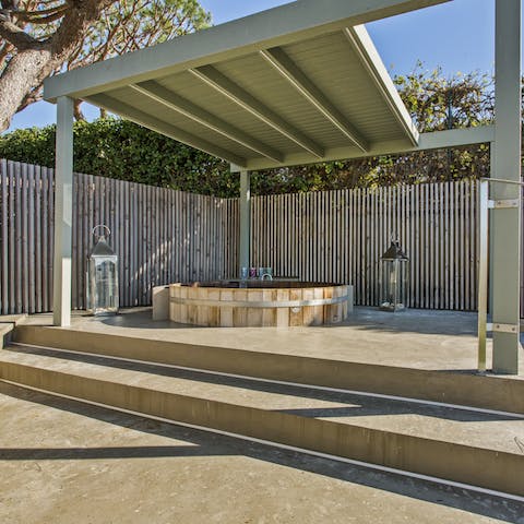 Enjoy a candlelit soak in the outdoor hot tub