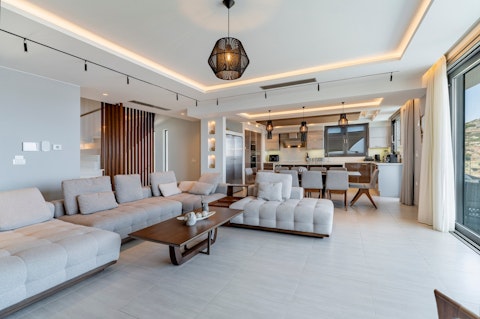 Gather in the generous living and dining area with spectacular sea views