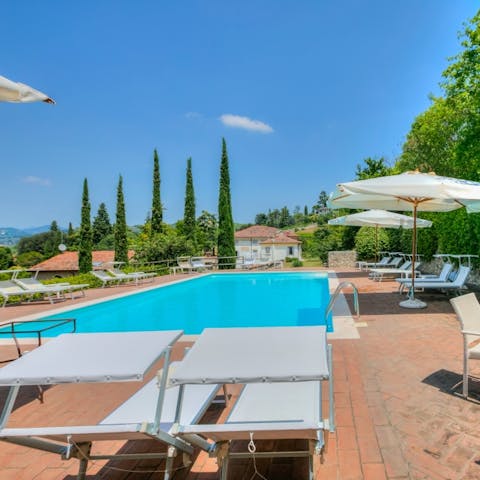 Spend your days stretched out under the sun by the communal pool