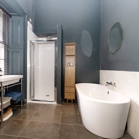Relax in the freestanding bathtub after a walk up to the castle