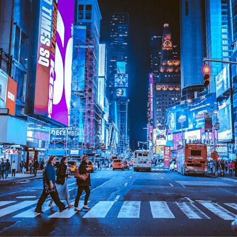 Visit the iconic Times Square at night, a ten-minute walk away