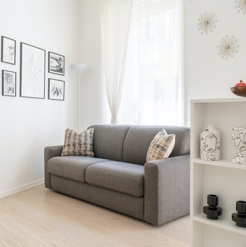 Relax on the sofa with a glass of Italian wine after a busy day of touring the city