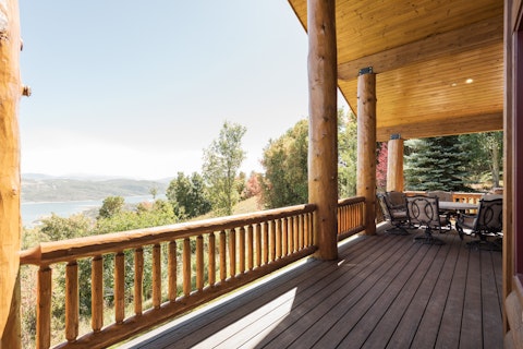 Sit out on the log-railed deck overlooking Lake Jordanelle
