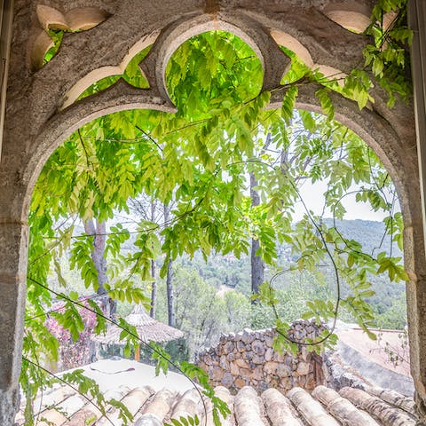 Admire views of the Mediterranean hills from your bedroom