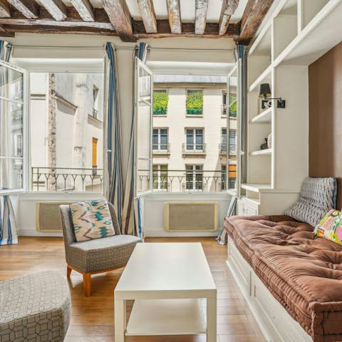 Peer out onto Le Marais life with your morning coffee