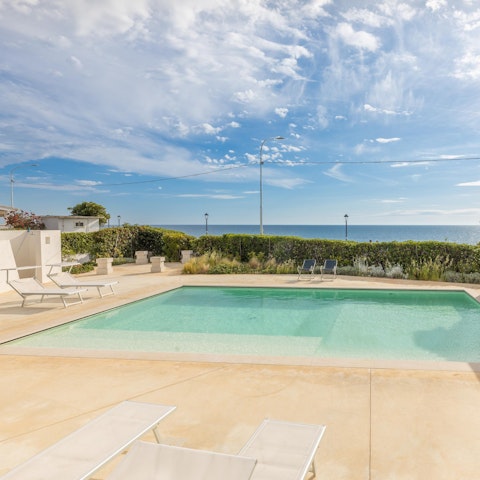 Admire sea views from the pool terrace