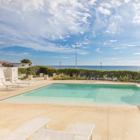Admire sea views from the pool terrace