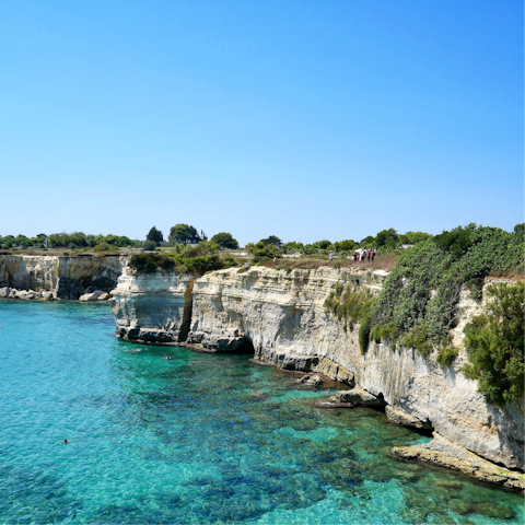 Snorkel in the clear waters of Torre Suda, 30 metres away
