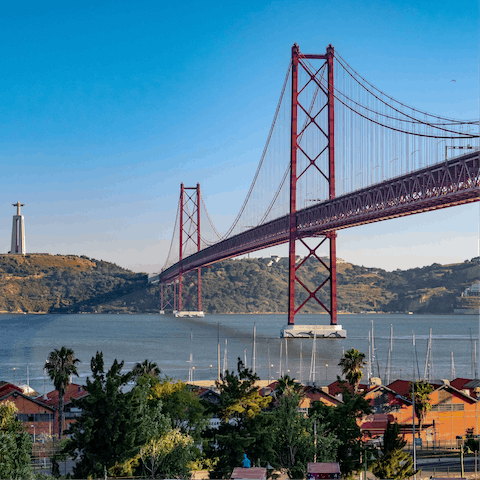 Rent an electric scooter and whizz along the riverfront to the 25 de Abril Bridge – it'll take around twenty minutes