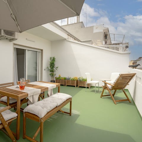 Enjoy an aperitivo on the private rooftop terrace