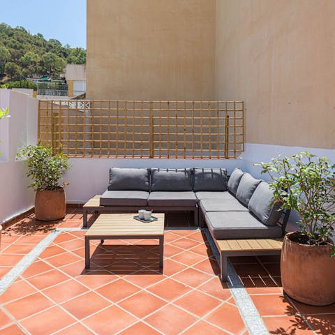 Relax and soak up the sunshine on the penthouse's terrace