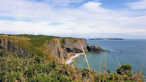 Explore Pembrokeshire Coast's dramatic clifftop trails and hidden coves, around a one-and-a-half-hour drive away
