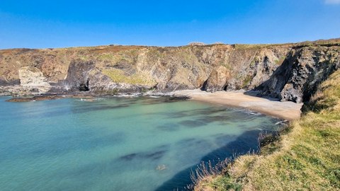 Uncover Pembrokeshire's intimate hidden coves tucked beneath ancient sea cliffs