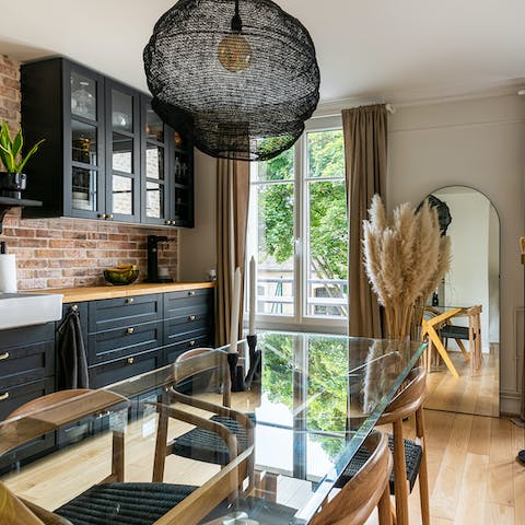 Tuck into homemade meals together by the rustic kitchen
