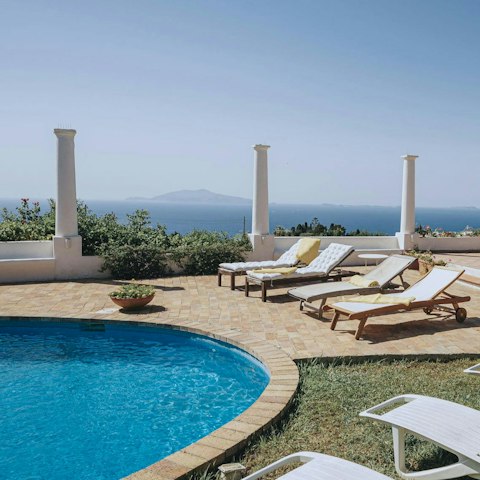 Find peace and relaxation while lounging by the pool