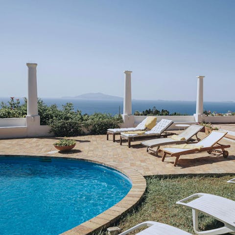 Find peace and relaxation while lounging by the pool